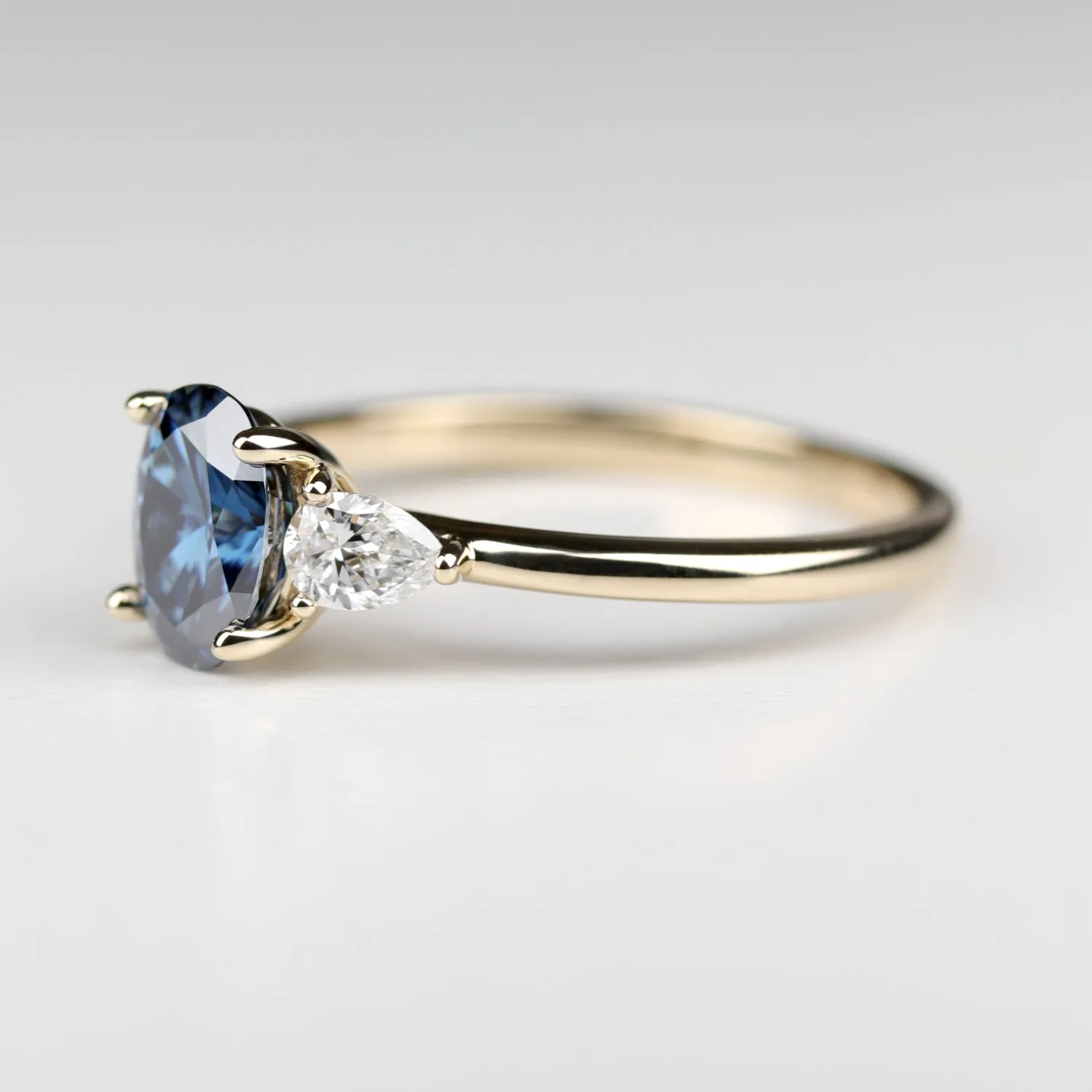 Oval Pear Basket Three Stone Ring with Oval Blue Moissanite