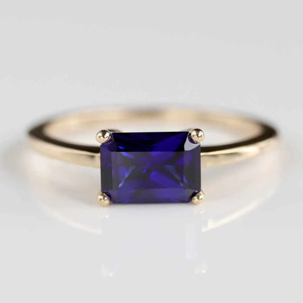 Sapphire Emerald Cut East-West Basket Solitaire